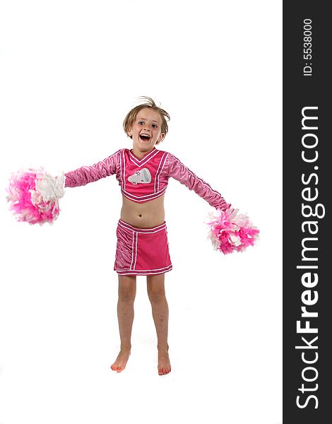 Cute girl doing a cheering routine in a pink outfit and pom poms