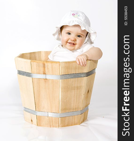 Baby girl in cedar planter. Baby girl in cedar planter