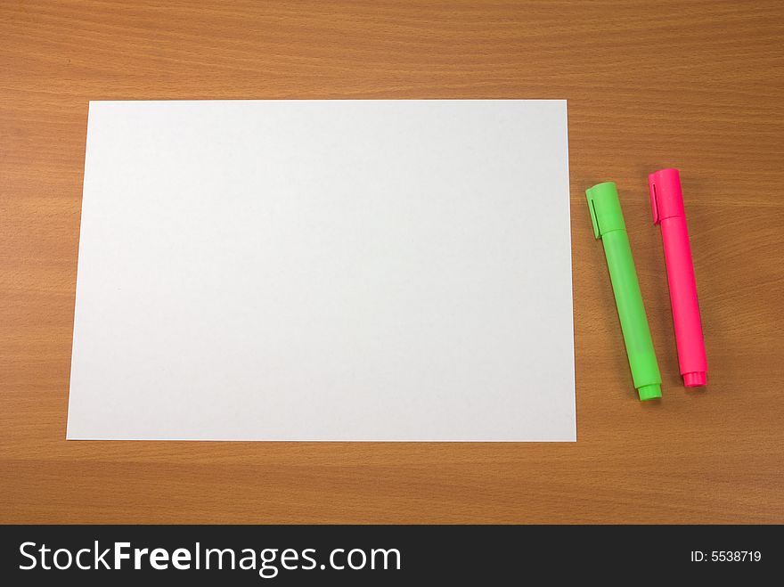 Two markers and blank paper sheet. Can be used as frame - paper color in RGB - 255,255,255. Two markers and blank paper sheet. Can be used as frame - paper color in RGB - 255,255,255