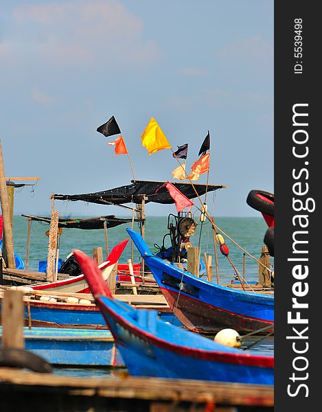 Fishing boat docked by the sea. Fishing boat docked by the sea