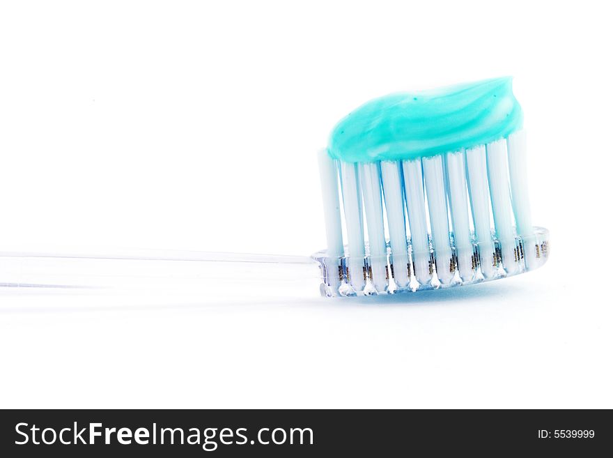 Isolated photo of a tooth-brush with drop of tooth-paste. Isolated photo of a tooth-brush with drop of tooth-paste