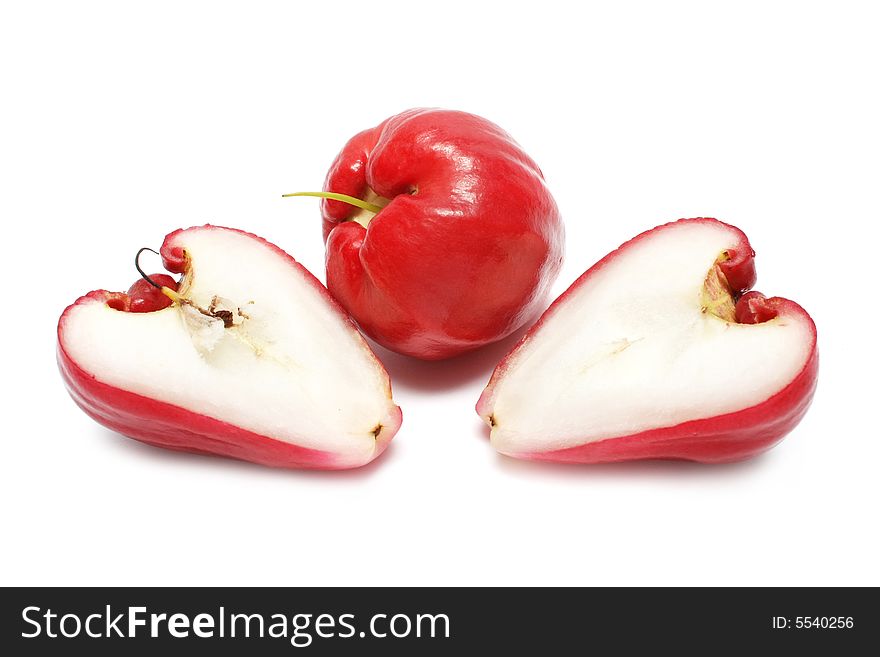 Water apple cut into half on white background. Water apple cut into half on white background.