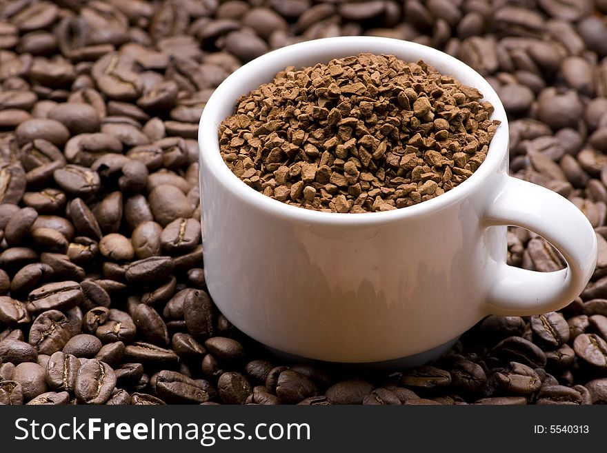 Coffee granules in a white cup