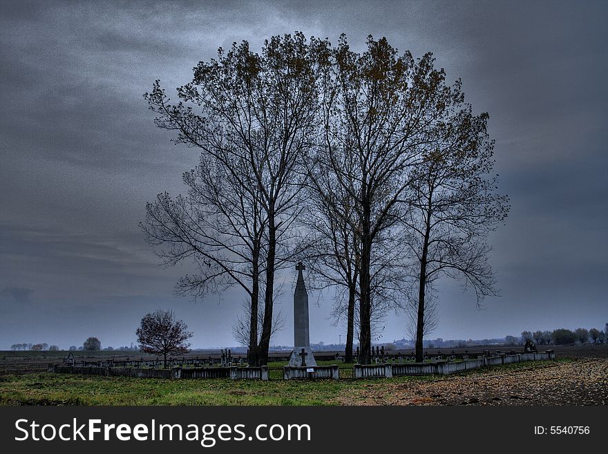 Old war cemetary witch trees and dark cloudy sky. Old war cemetary witch trees and dark cloudy sky.