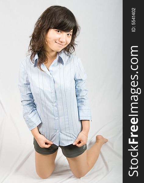 A young asian belle with knickers and light blue shirt