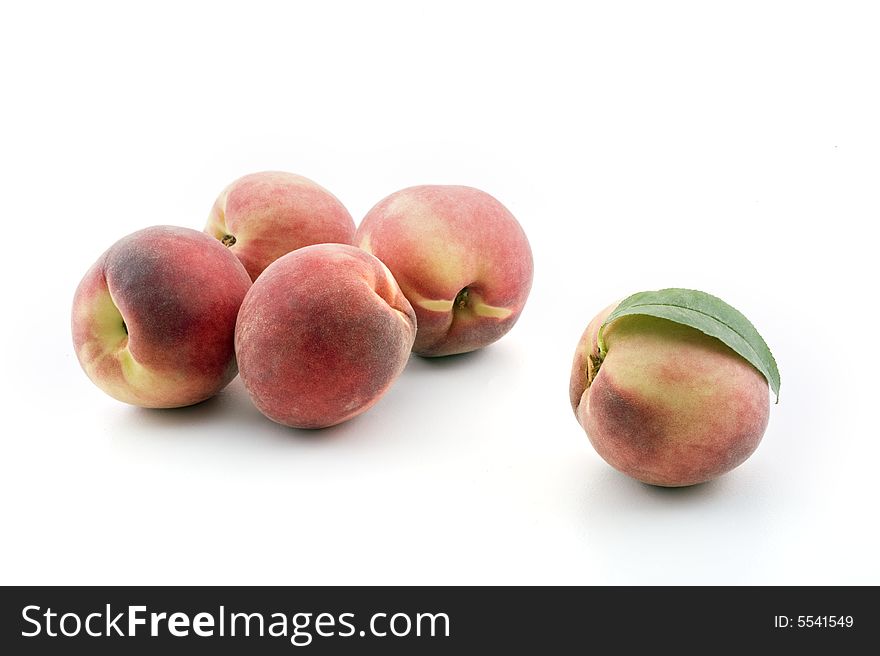 Group of five peaches isolated on white