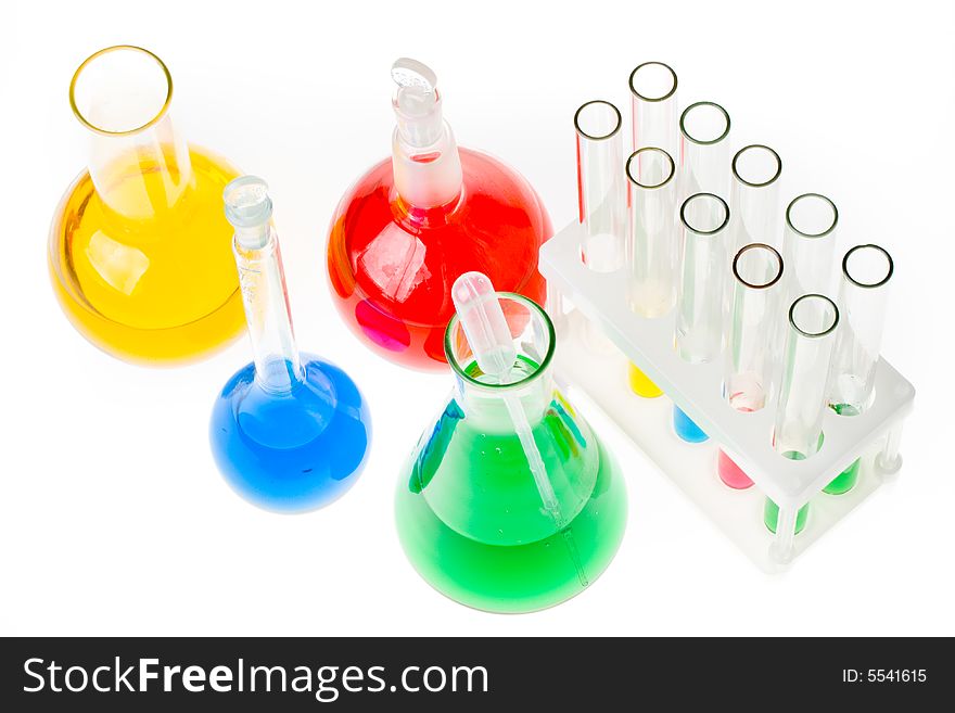 Various colorful glass laboratory ware on a white background. Various colorful glass laboratory ware on a white background