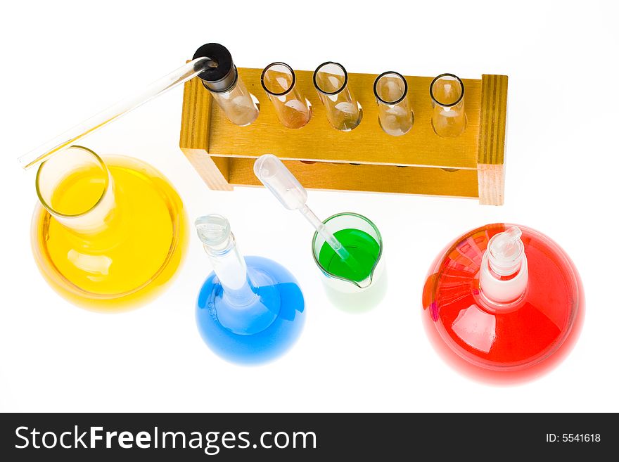 Various colorful glass laboratory ware on a white background. Various colorful glass laboratory ware on a white background