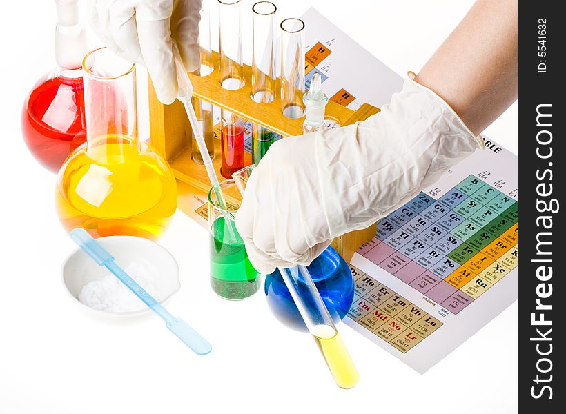 Various colorful glass laboratory ware on a white background. Various colorful glass laboratory ware on a white background