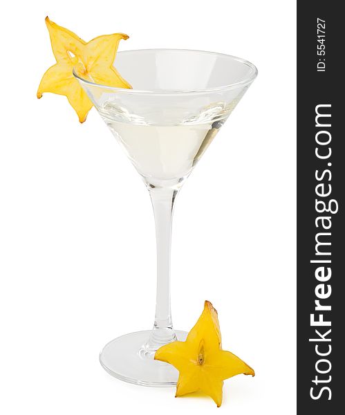 Glass of martini and slice of carambola on a white background. Glass of martini and slice of carambola on a white background