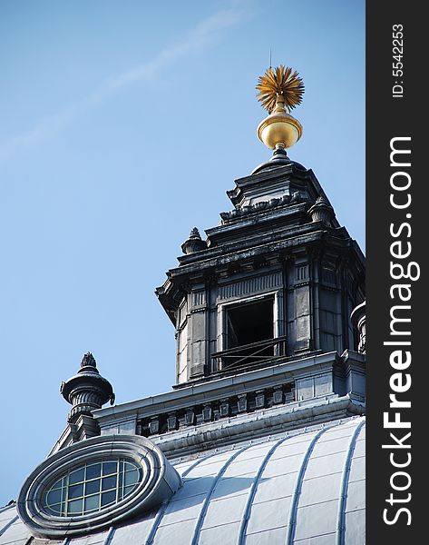 An old wooden blue building with golden top. London, UK. An old wooden blue building with golden top. London, UK.