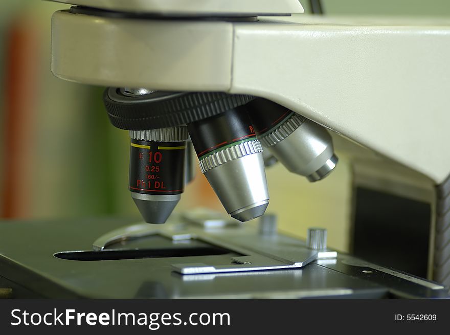 Detail of microscope lenses in a laboratory