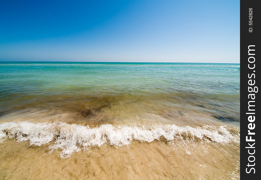 Empty Beach And Waves