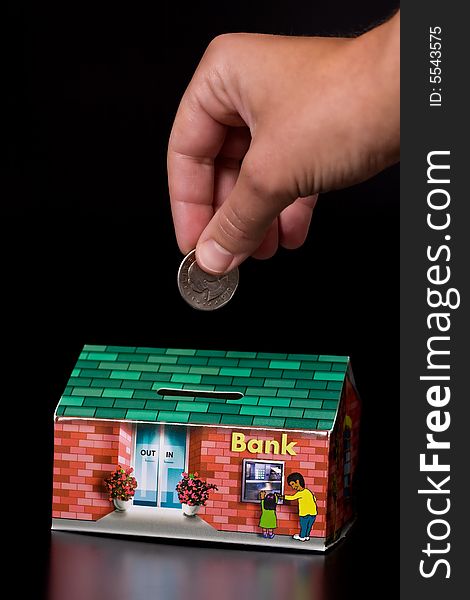 Quarter coin and cardboard bank box