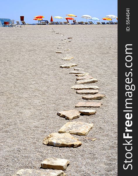 Stone path on the scorching sand. Stone path on the scorching sand