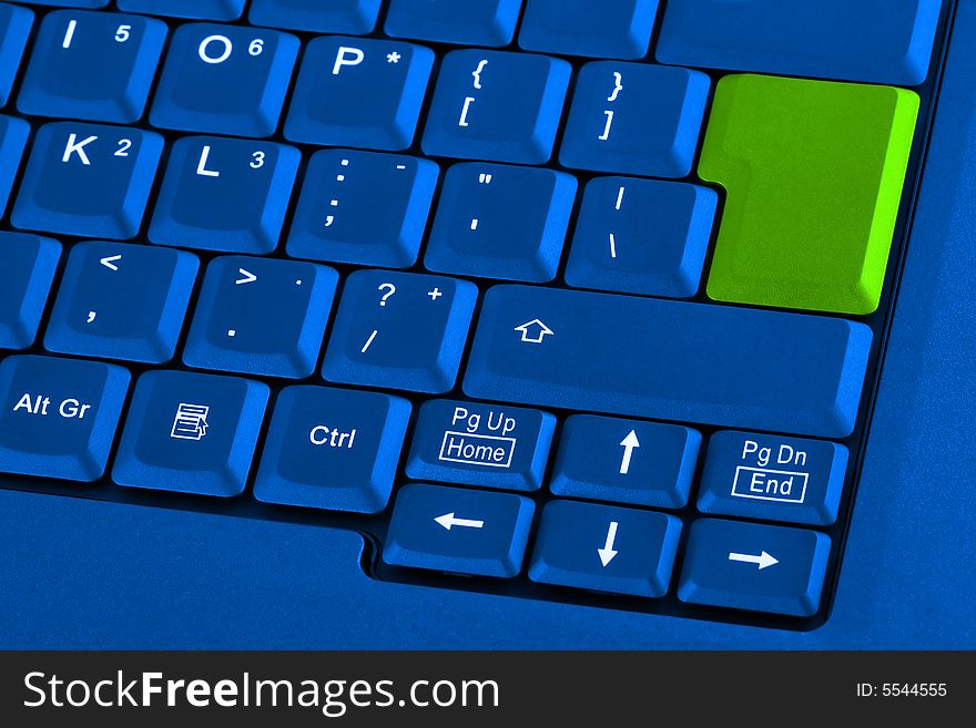 Blue keyboard with green blank button. Blue keyboard with green blank button