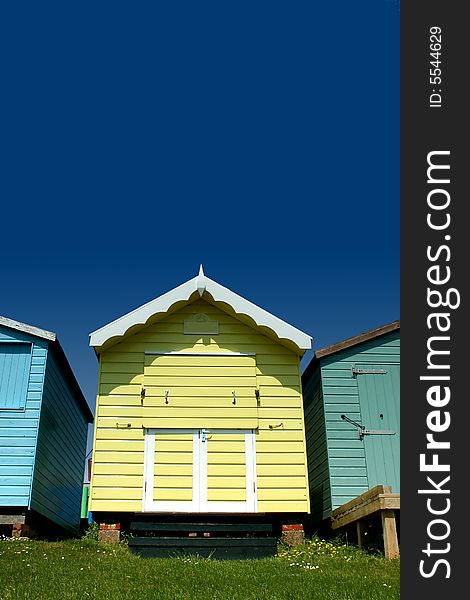 Yellow beach hut with clear blue sky above. Yellow beach hut with clear blue sky above