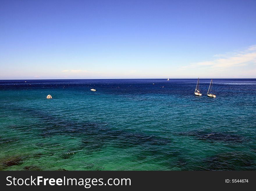 Seascape of blue mediterranean sea and boats, Island of Sicily, Italy Holiday. Seascape of blue mediterranean sea and boats, Island of Sicily, Italy Holiday