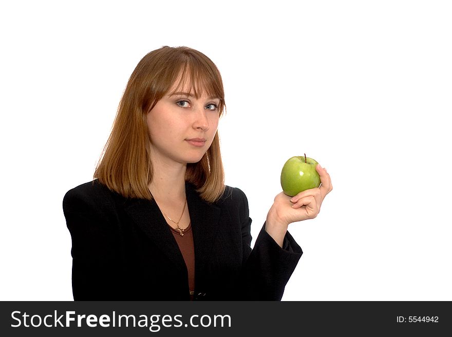 The young woman holds an apple. The young woman holds an apple