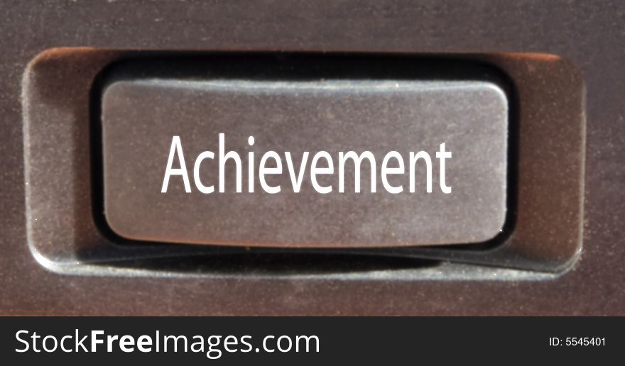 Closeup of a button marked achievement