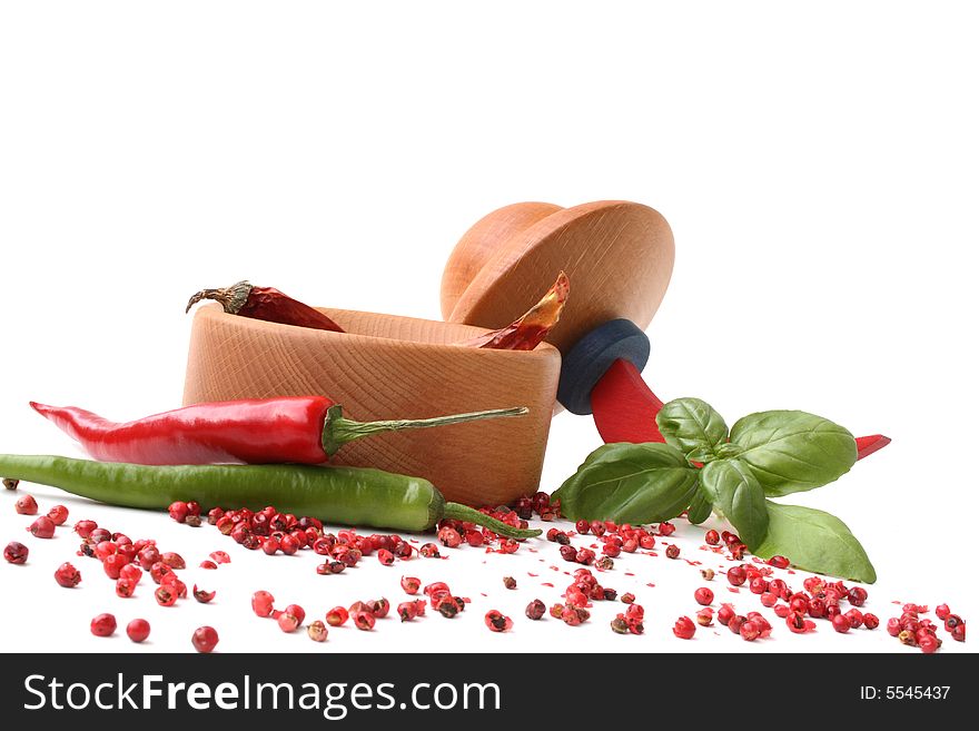 Chili peppers in mortar, isolated background. Chili peppers in mortar, isolated background