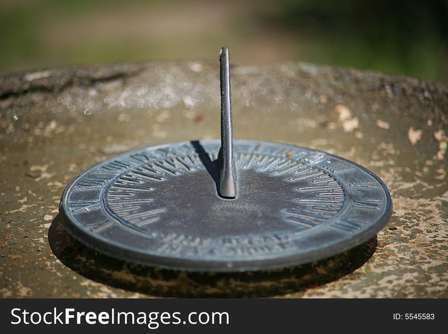 This is a picture of a sundial in a birdbath as a centerpiece to a wildflower garden in Washington. This is a picture of a sundial in a birdbath as a centerpiece to a wildflower garden in Washington.