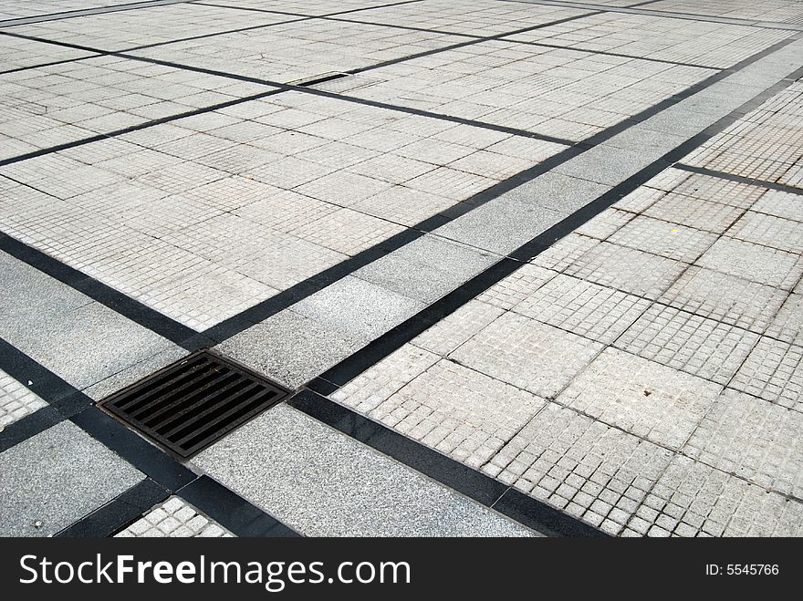 Structured street marble and bricks pavement.