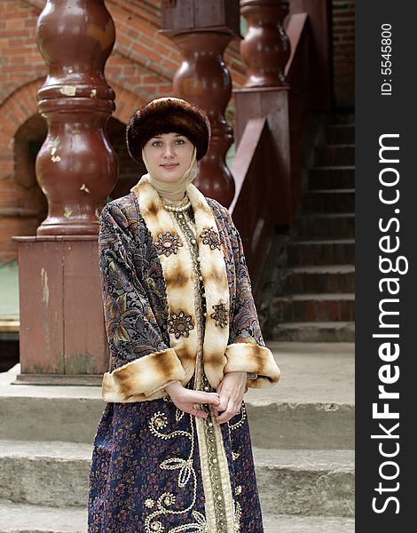 The tourist in historical clothing in summer