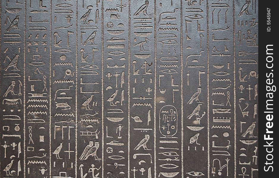 Ancient egiptian hyeroglyphs engraved in a black stone. Ancient egiptian hyeroglyphs engraved in a black stone