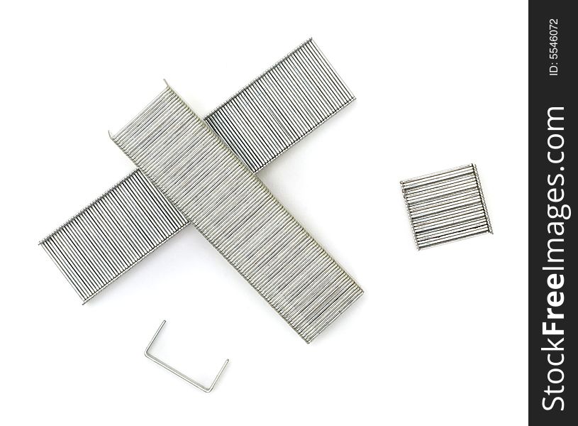 A close up of a collection of staples shot against a white background.