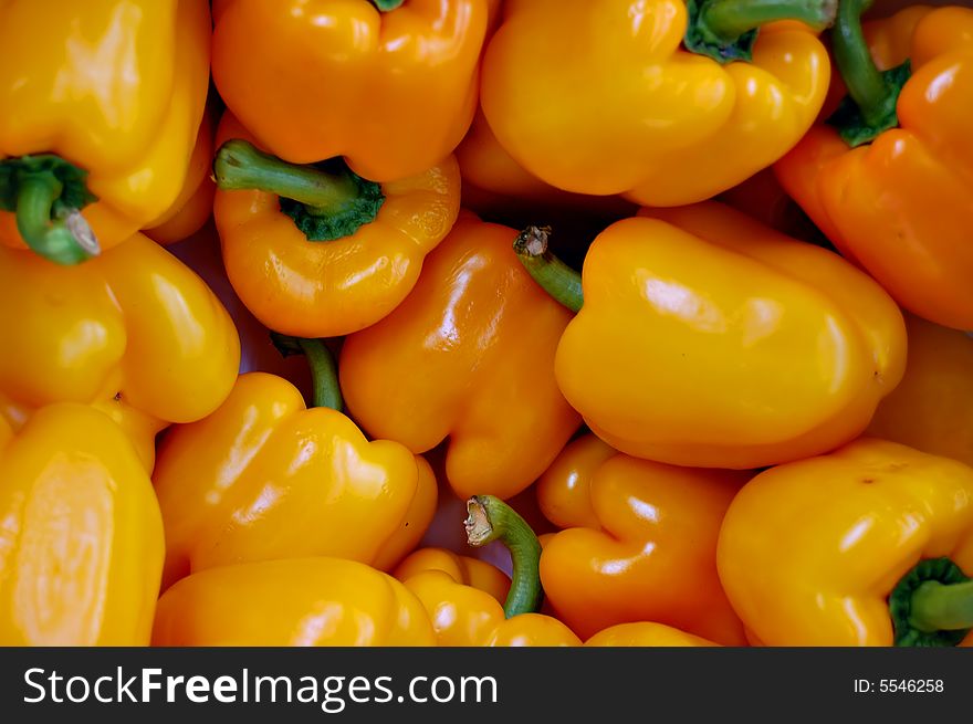 A group of beautiful bright fresh yellow peppers. A group of beautiful bright fresh yellow peppers