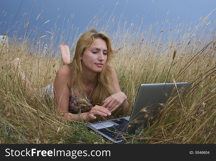 Girl in a floor with laptop