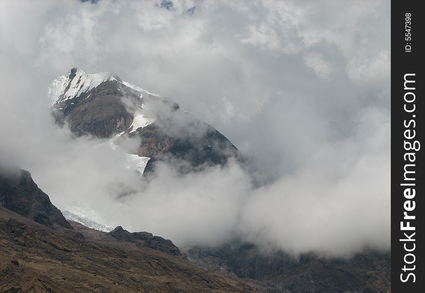 Peruvian Mountains shown through high altitude cloud cover. Peruvian Mountains shown through high altitude cloud cover
