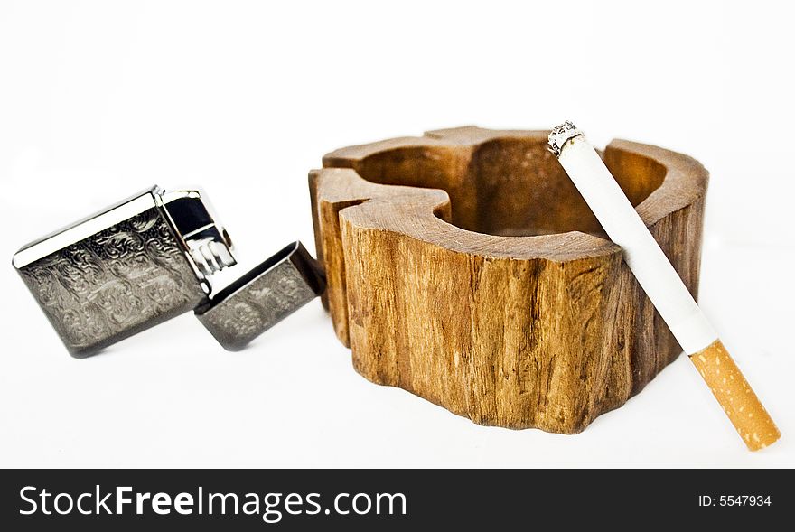 Lighter, ashtrays and cigarette on a white background. Lighter, ashtrays and cigarette on a white background