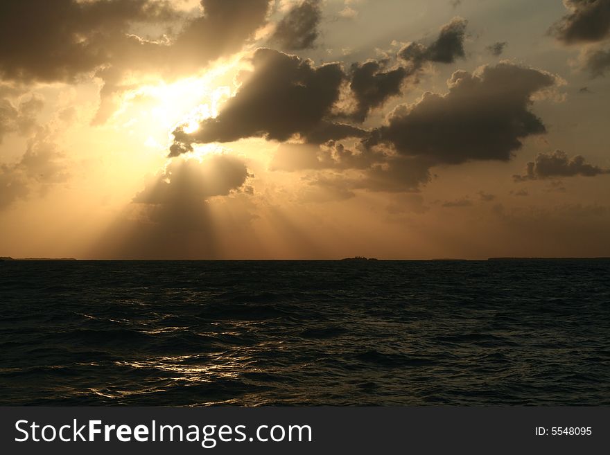 A dramatic sunset and the light and shadows from the clouds. A dramatic sunset and the light and shadows from the clouds.