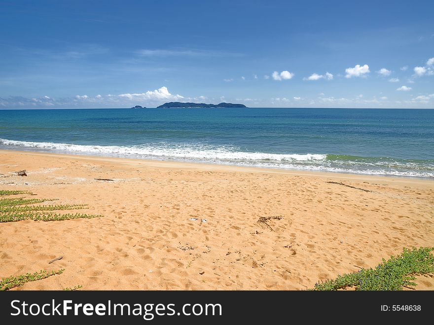 Picture of faraway Kapas Island in Malaysia taken from mainland with blue sea blue sky and sandy beach. Picture of faraway Kapas Island in Malaysia taken from mainland with blue sea blue sky and sandy beach.