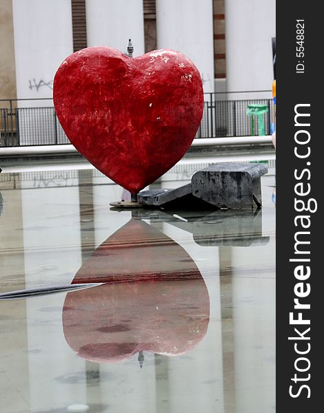 Heart and its reflection in the water in Paris, France.