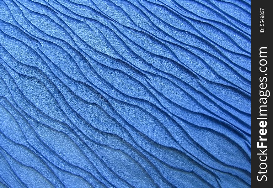 Beautiful blue shawl texture like sea waves. Beautiful blue shawl texture like sea waves.