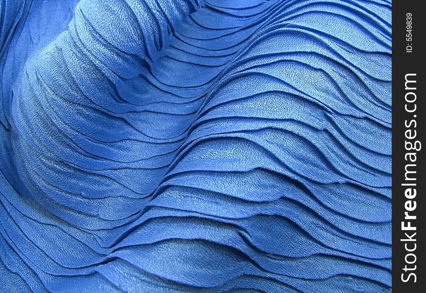Beautiful blue shawl texture like sea waves. Beautiful blue shawl texture like sea waves.