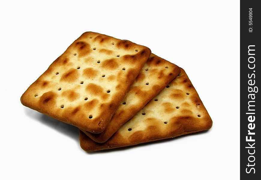An isolated three crackers cookies.