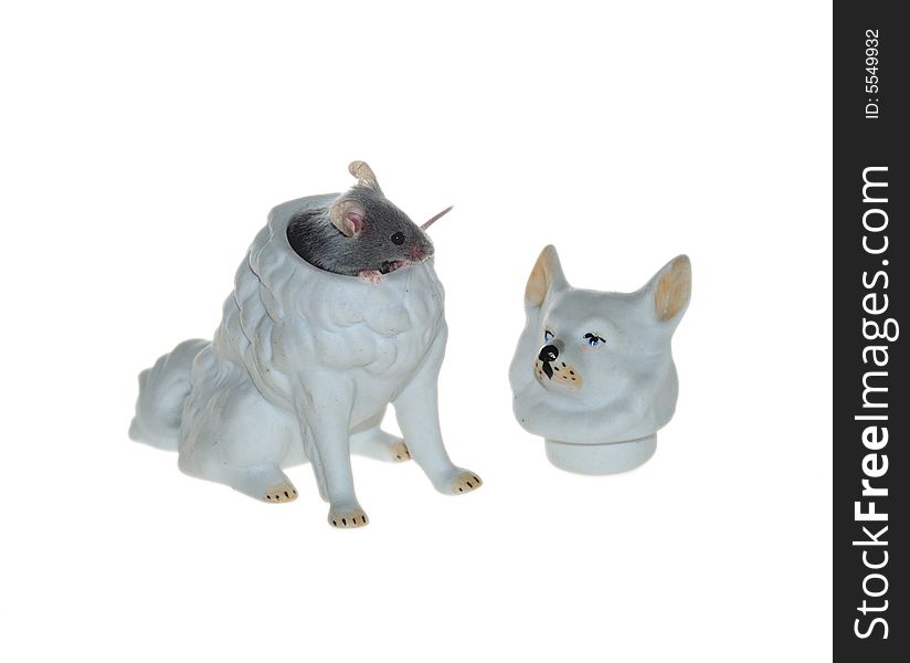 Mouse hiding in the dog's porceline sculpture. Mouse hiding in the dog's porceline sculpture