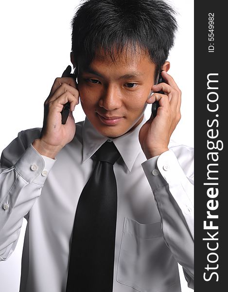 Asian Business Man Busy With Multiple Handphones