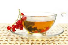 Currant And Tea In A Transparent Cup Royalty Free Stock Photo
