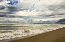 Empty Beach Duiring A Storm With Heavy Clouds Stock Photography