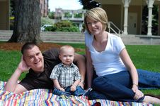 Family Lying Together In Grass - Horizontal Stock Photo Family Lying Together In Grass - Horizontal Stock Photo