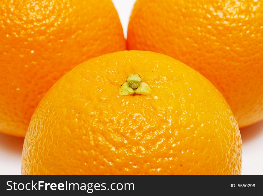 Closeup of three oranges as whole background.