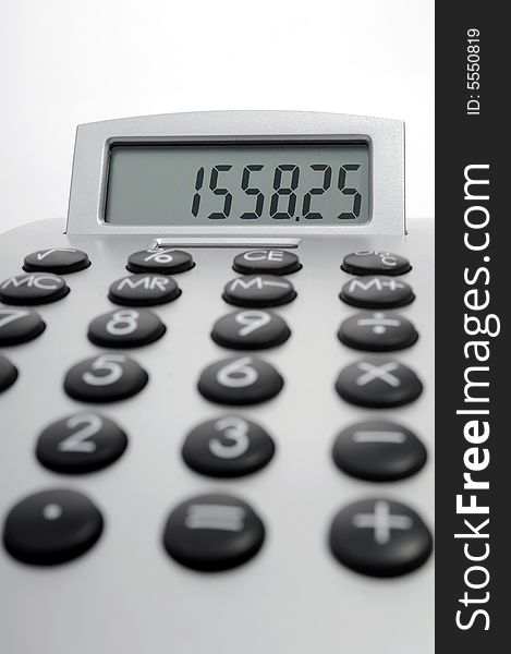 An electronic calculator on white background