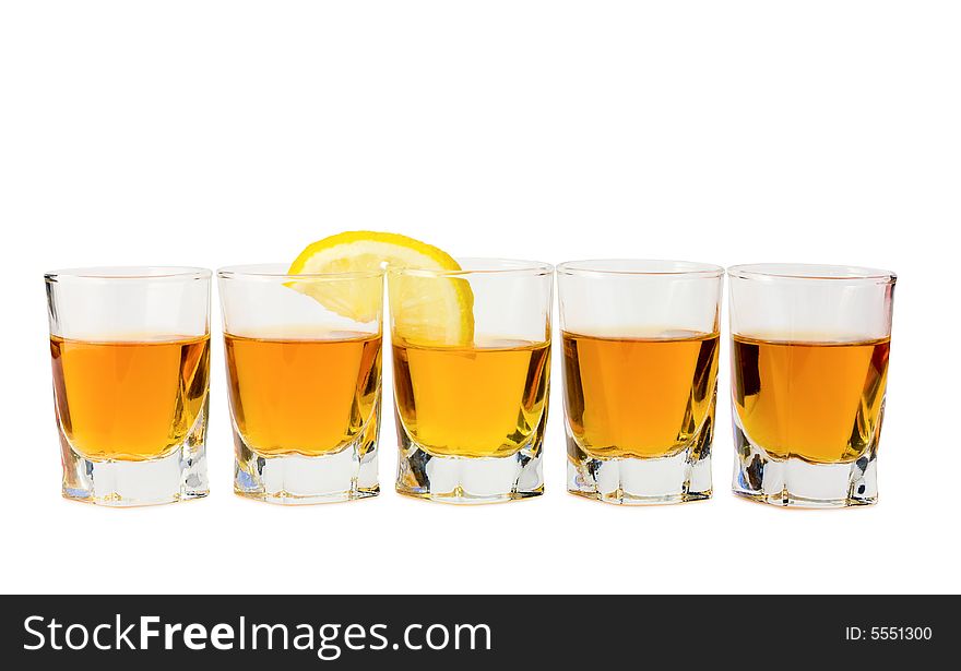 Drink and a slice of fresh lemon isolated on white background. Drink and a slice of fresh lemon isolated on white background.