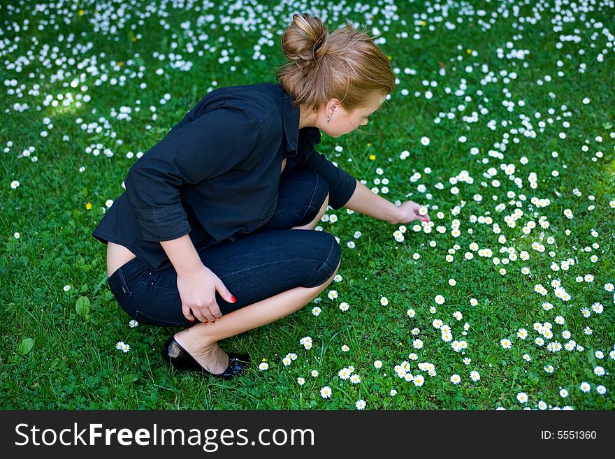 Portrait of the beautiful young girl on nature