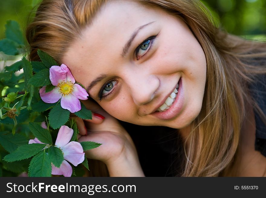 Portrait of the beautiful young girl on nature